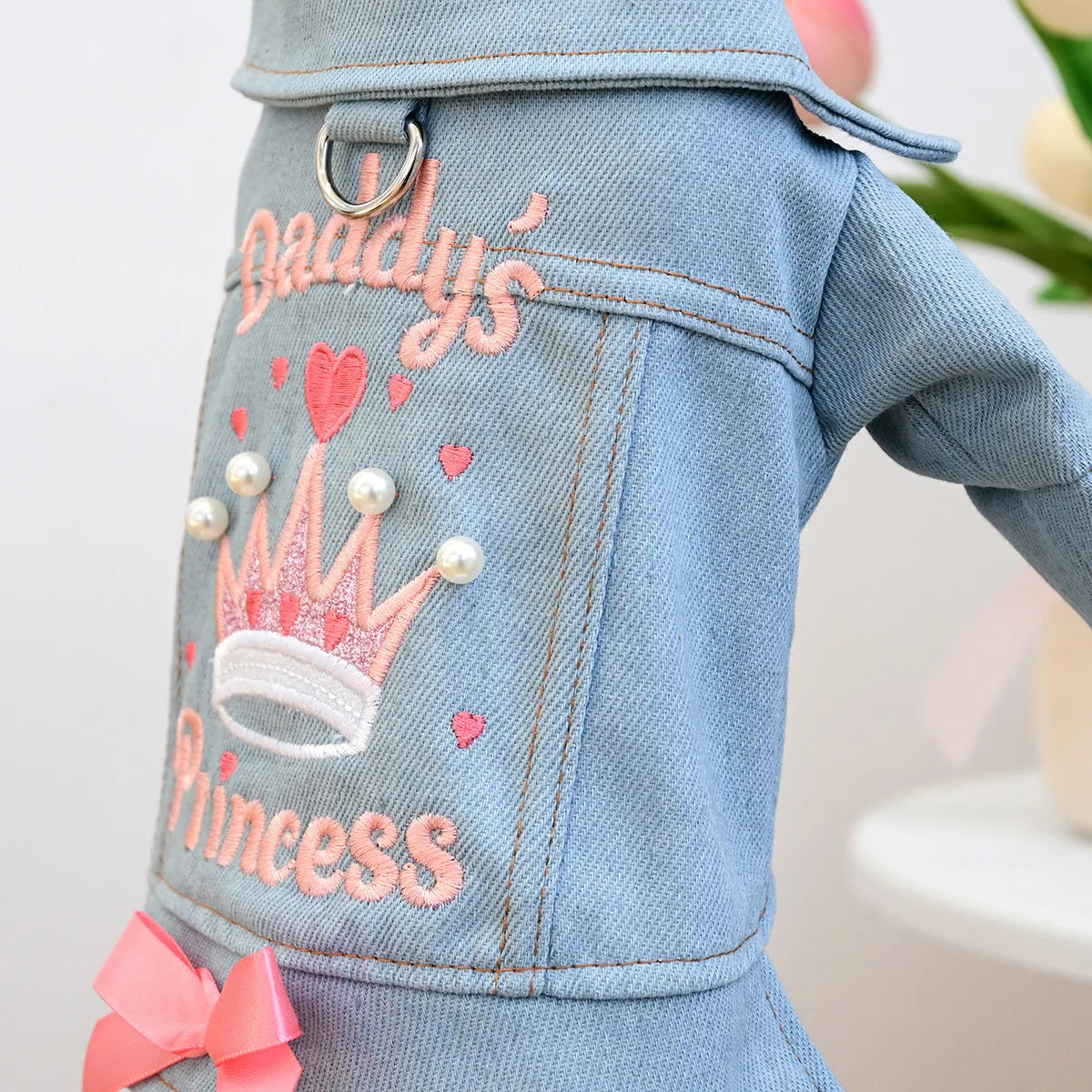 Light blue denim jacket embroidered with 'Lady's Princess' text and a pink crown