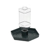 A clear glass automatic reptile water dispenser bowl with a dark gray base.