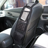 A black car backseat organizer with a mesh tablet holder and storage pockets installed on the seat.