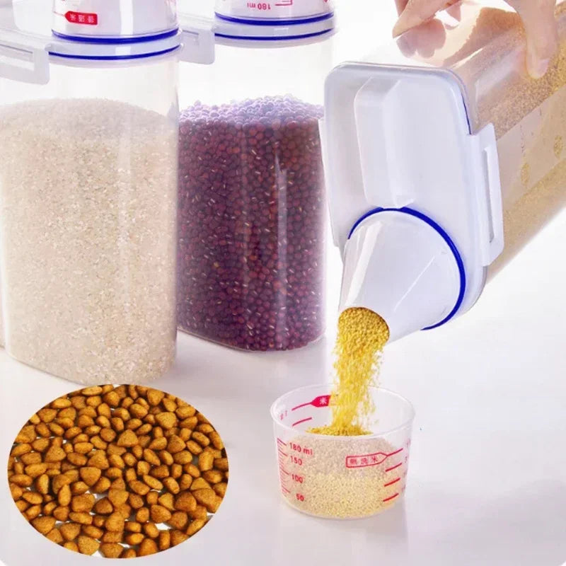A clear airtight pet food storage container is shown with various colored pet food ingredients, including grains and pellets,