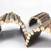 A collection of small, natural wood branches arranged in a curved shape for pet chew toys.