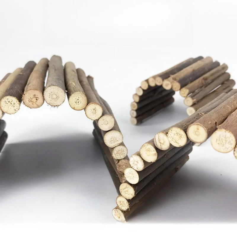 A collection of small, natural wood branches arranged in a curved shape for pet chew toys.