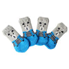 A pack of four anti-scratch cotton pet socks for small dogs and cats featuring gray and blue stripes.