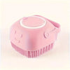 A pink gentle dog bath brush with a shampoo dispenser is shown from above.