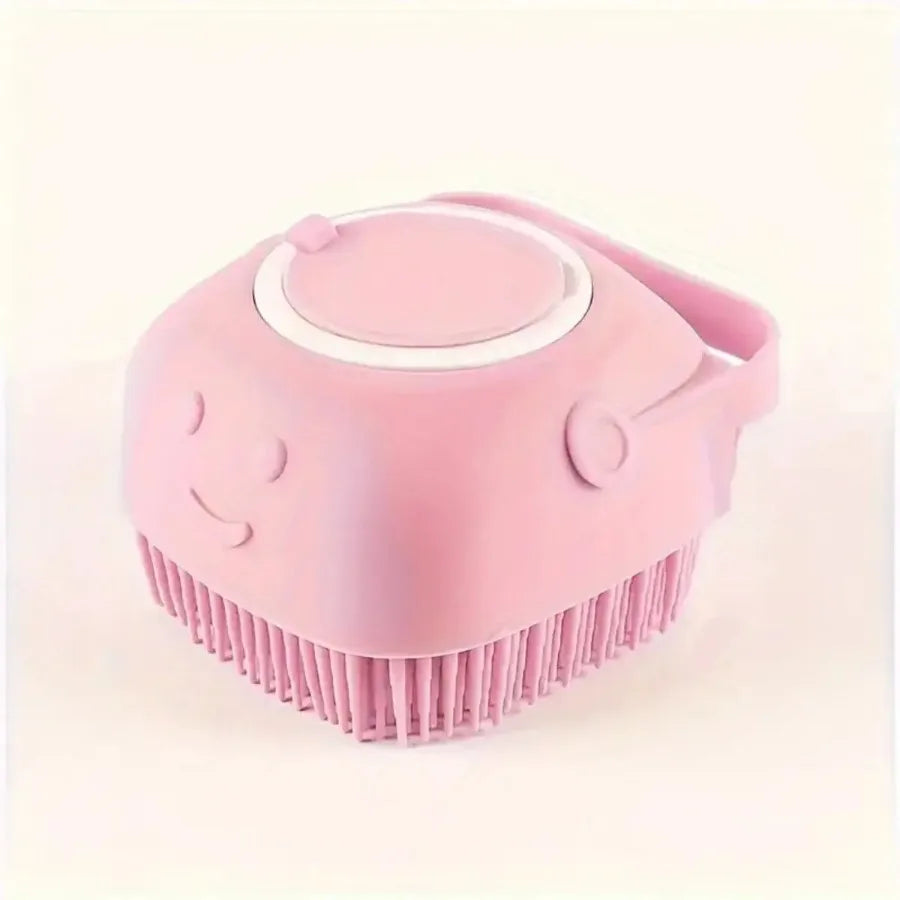 A pink gentle dog bath brush with a shampoo dispenser is shown from above.