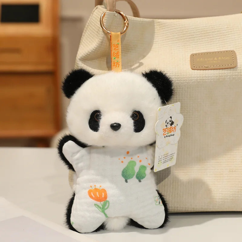 A white and black panda bean bag plush toy hanging from a light-colored fabric bag.