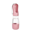 A pink 2-in-1 portable pet water and food dispenser with a clear reservoir and a silicone straw.