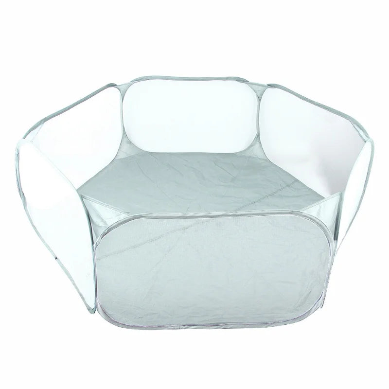Clear portable pet playpen with a rounded, hexagonal shape for small animals