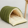 A plush cat cave bed in olive green fabric with a removable cream-colored lining.