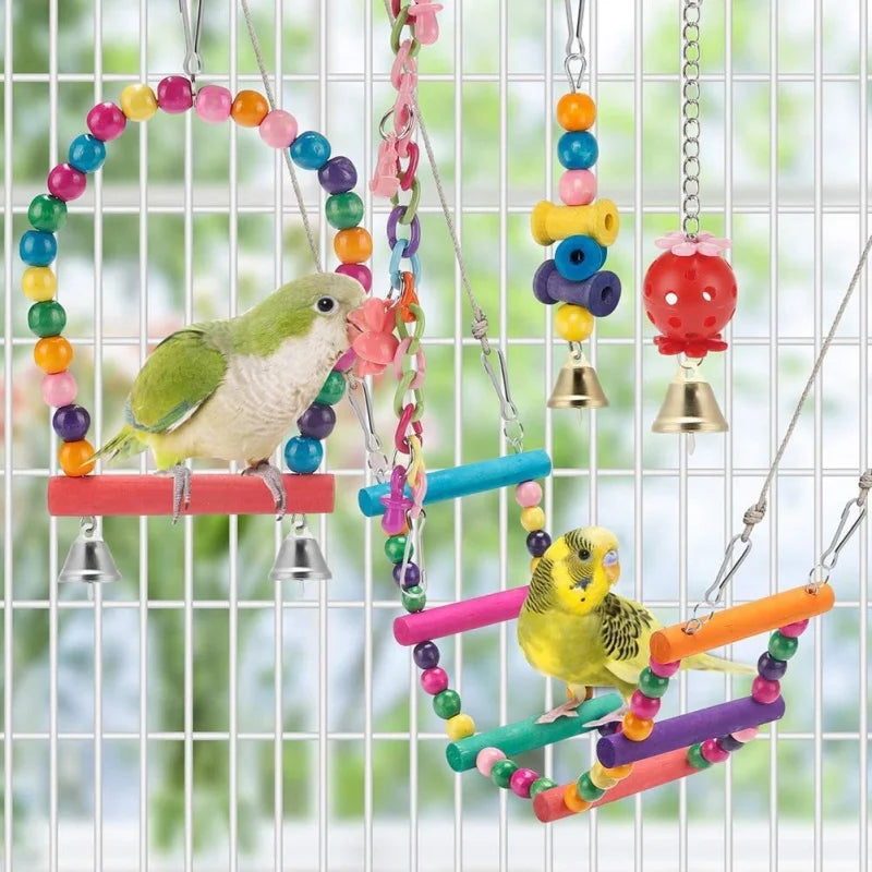 A parrot is perched on a natural wooden swing toy decorated with colorful beads and natural wood pieces.
