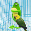 A yellow parrot is perched on a green feeding stand inside a blue wire cage.