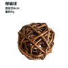 A brown, woven grass chew ball for small pets.