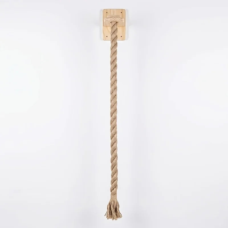 A natural fiber rope hanging from a wooden plank, used as a wall mounted cat scratching post.