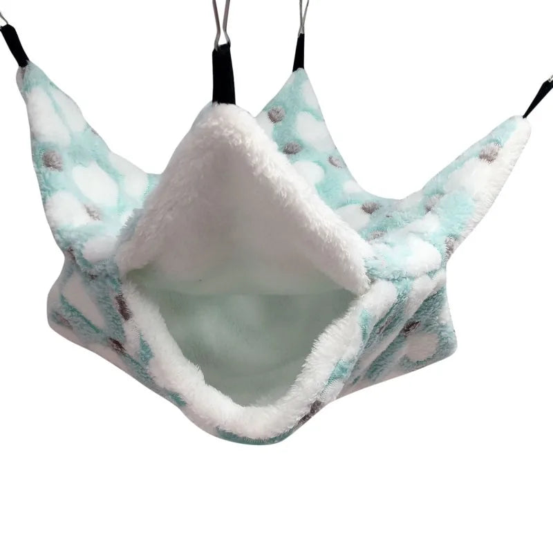 A cozy fleece double layer hammock bed for hamsters with light blue and white fluffy material.