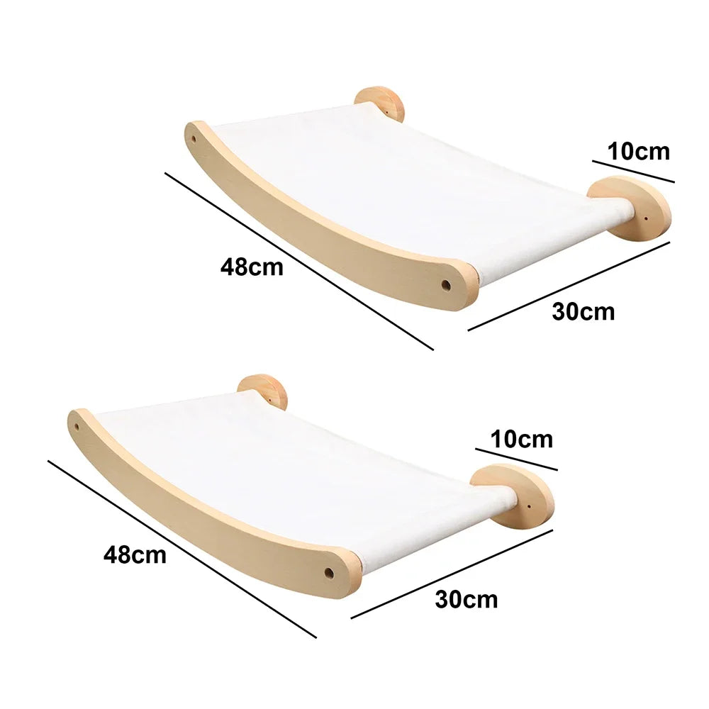 A wooden wall-mounted cat climbing shelf and hammock with dimensions 48cm by 30cm.