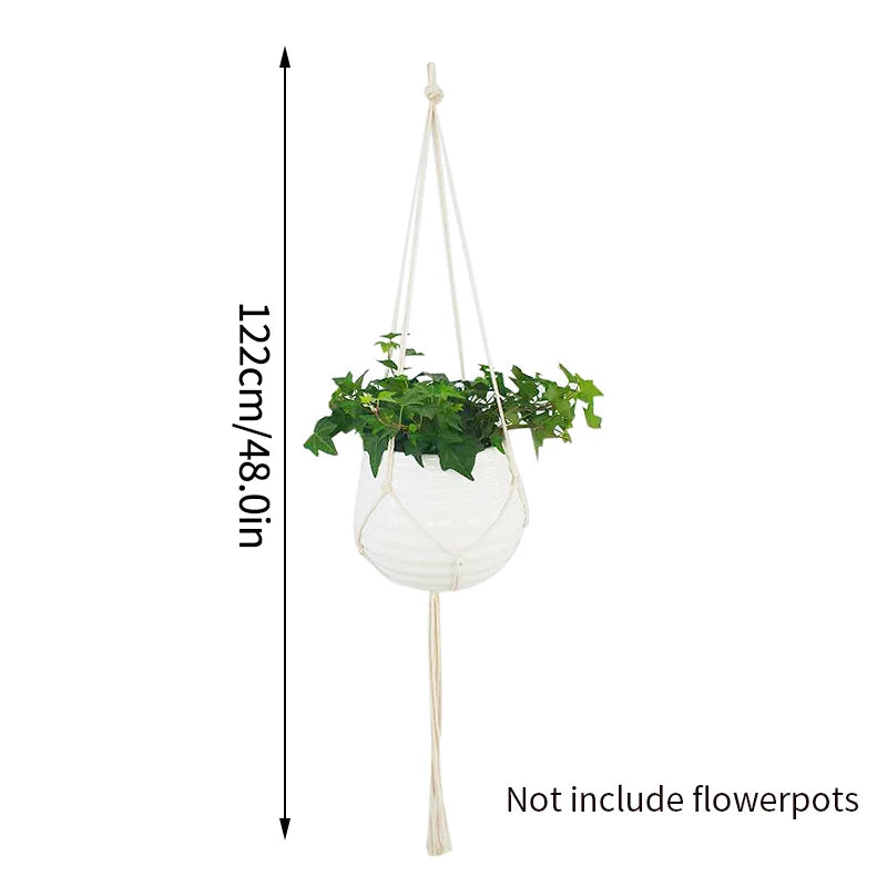 White macrame plant hanger with a hanging plant and a long cord for indoor or outdoor decor