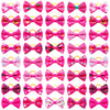 A collection of adorable pet hair bows in various colors and patterns with gentle rubber bands.