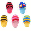 A set of colorful plush dog chew toys including striped pink and black slippers, a heart-patterned blue slipper, and yellow s