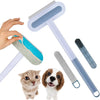 A hand holds a light blue pet hair remover brush and a green brush, with two dogs nearby.