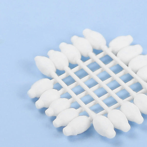A white foam product featuring multiple cotton swabs arranged in a star pattern on a light blue background.