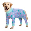 A golden retriever wearing a light blue cartoon print cotton pajama top.