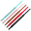 A set of five adjustable leather spiked dog collars in various pastel and bright colors.