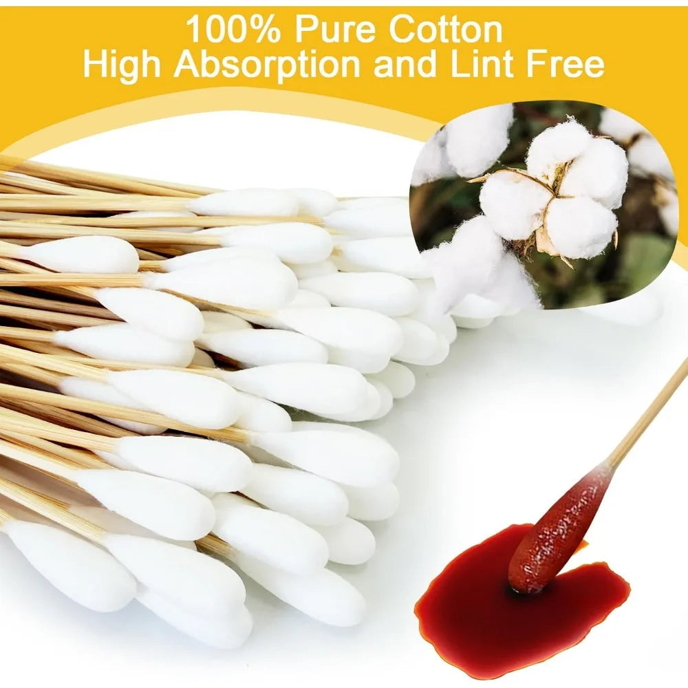 A bundle of white cotton swabs with absorbent tips and lint-free material shown next to a drop of red liquid.