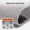 Close-up view of a gray cat litter mat showing both a bottom anti-skid design and a notch design.
