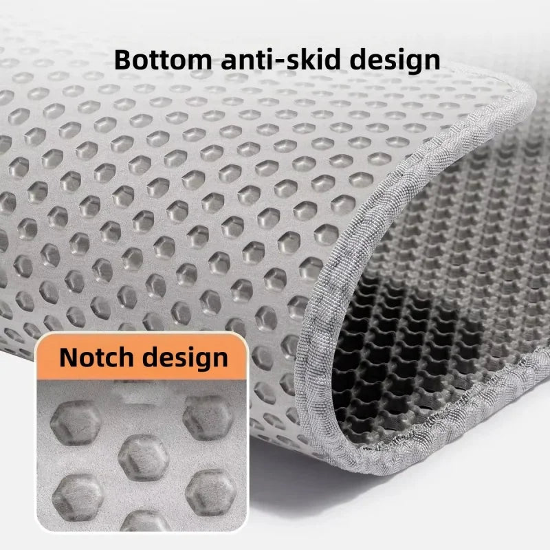 Close-up view of a gray cat litter mat showing both a bottom anti-skid design and a notch design.
