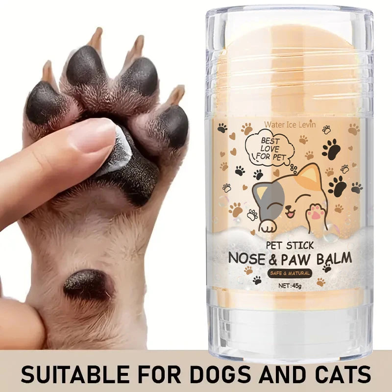A hand is applying pet stick nose and paw balm for dogs and cats onto a cat's paw.