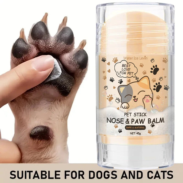 A hand is applying pet stick nose and paw balm for dogs and cats onto a cat's paw.