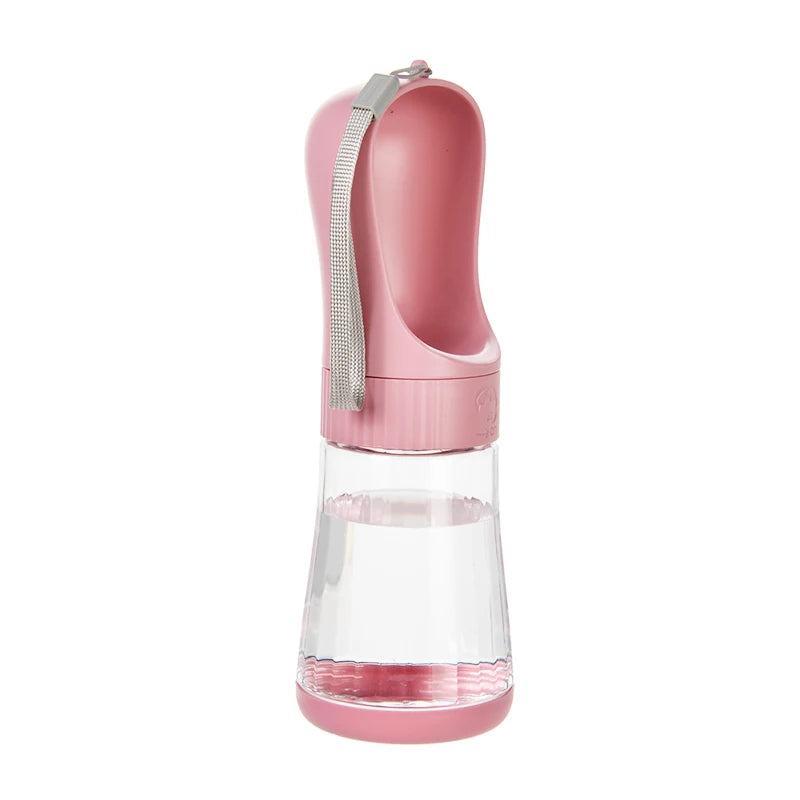 A pink 2-in-1 portable pet water and food dispenser with a clear glass reservoir and a silver strap.