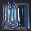 A set of professional stainless steel pet grooming scissors, combs, and brushes laid out on a black case.