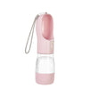 A pink portable 2-in-1 dog water bottle and food dispenser with a flexible tube.