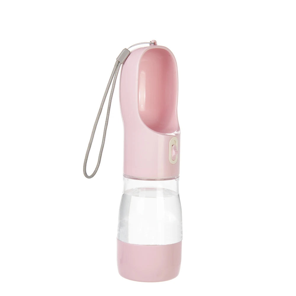 A pink portable 2-in-1 dog water bottle and food dispenser with a flexible tube.
