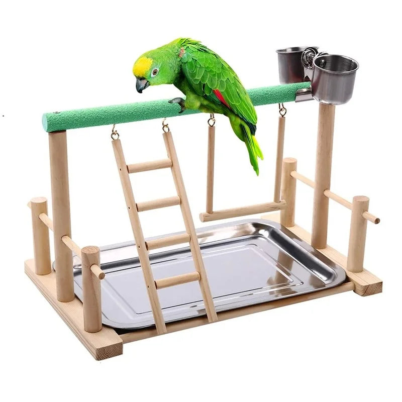 A multi-level bird activity center made of wood with a green perch and a hammock for a parrot.