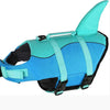 A bright turquoise dog life jacket with a fin, designed for swimming.