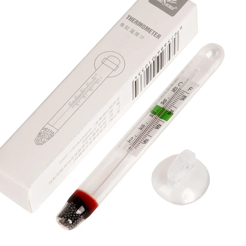 Ein weißes Thermometer mit rolicher Flüssigkeit neben seiner Verpackung.