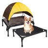 A portable elevated dog cot featuring a brown and yellow shade canopy over a black platform.