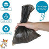 A hand is holding a black reusable pet poop bag, with icons indicating it is thick, leak proof, and eco-friendly.