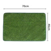 A rectangular green artificial grass dog potty pad measuring 70cm by 46cm.