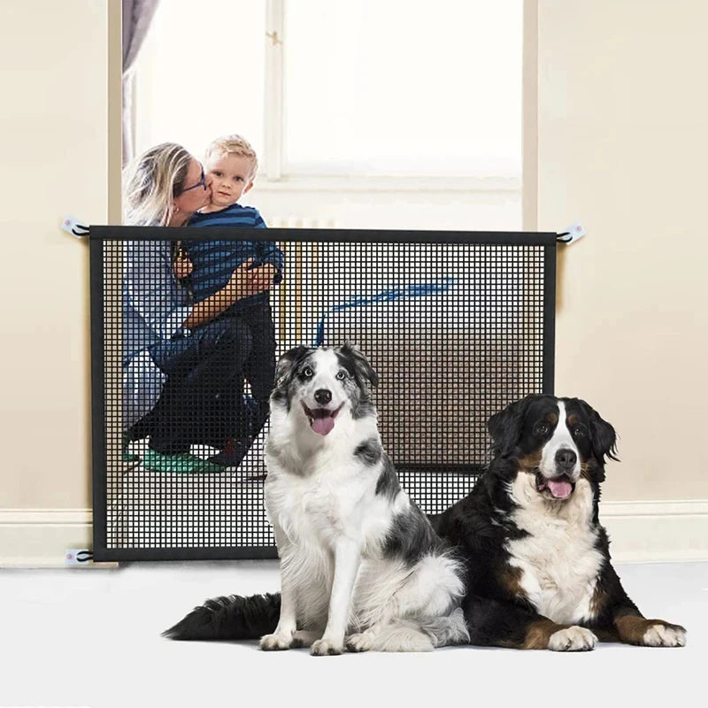 A black wire pet safety gate is shown with a dog and a child interacting near a window.