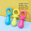 Three rubber chew toys in blue, yellow, and pink for small dogs