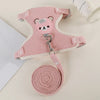 Pink padded rabbit harness and leash set with a round pink leash rolled up