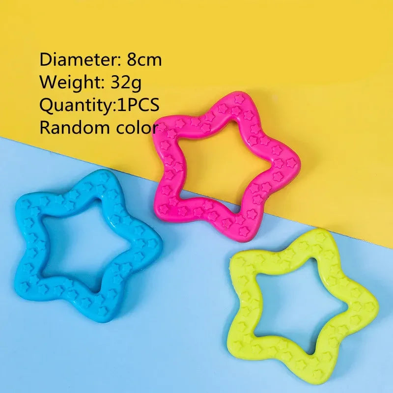 Four rubber chew toys in pink, blue, and yellow colors displayed on a light background.