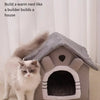 A gray pet house structure with an entrance, featuring a fluffy white cat sitting in front of it.