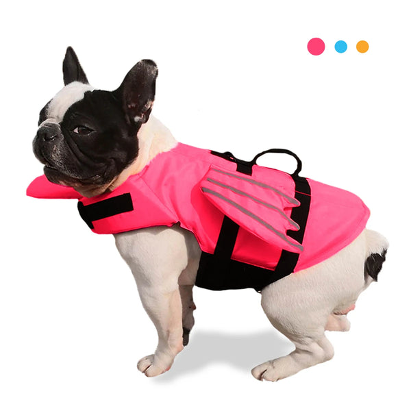 A pink dog life jacket with black accents is worn by a white and black bully breed dog.