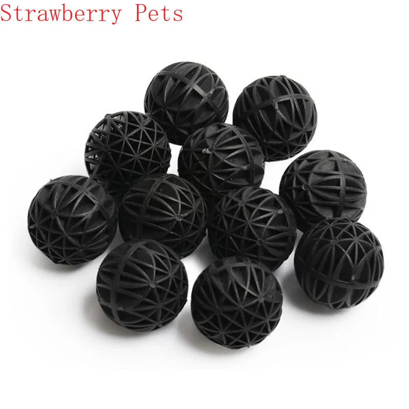 A collection of black strawberry pets, which are bio balls used for water filtration.