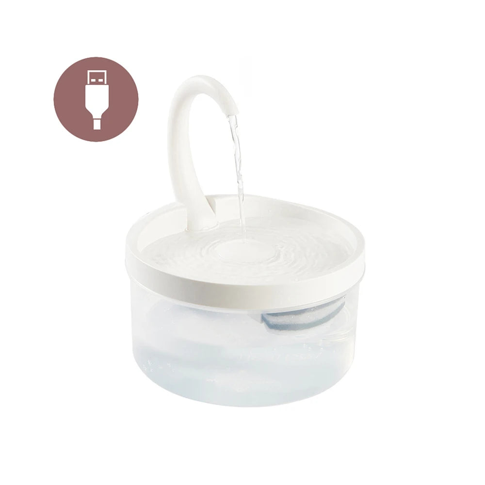 A clear pet water fountain with a white spout is shown, demonstrating its automatic water flow.