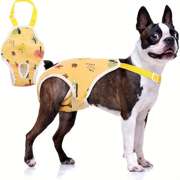 A black and white dog wearing yellow adjustable washable sanitary pants with shoulder straps.